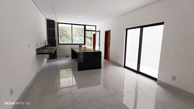 sala com cozinha em conceito aberto