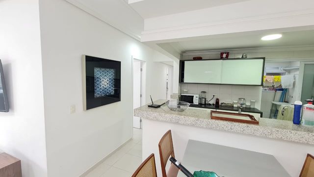 O amplo espaço de circulação que conecta os ambientes integrados, proporcionando fluidez e liberdade.