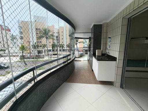 A vista da varanda para a área de lazer.