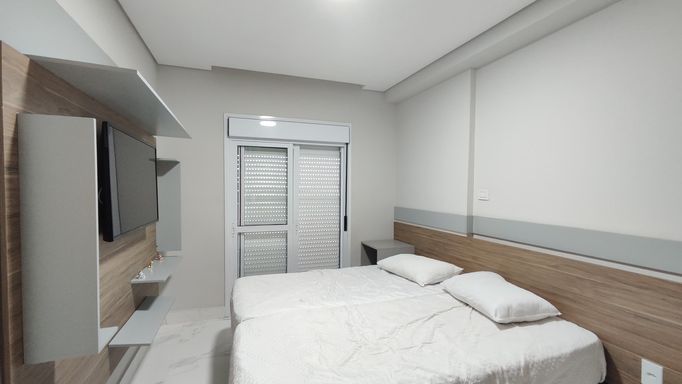 Terceiro dormitório ideal para hóspedes ou escritório.