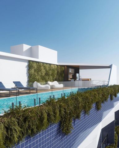 Rooftop com piscina e lounge integrado, oferecendo uma vista privilegiada e ambiente sofisticado para lazer e descanso.