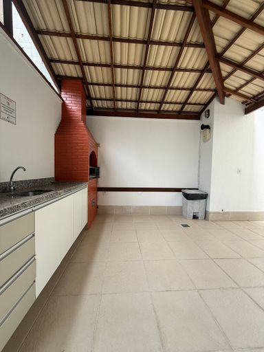 Salão de festas com churrasqueira