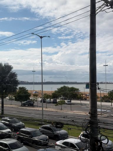 Sala com varanda de frente para o Mar
