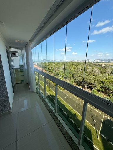 Sala com Varanda integrada e vista para o mar