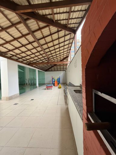 Salão de festas com churrasqueira