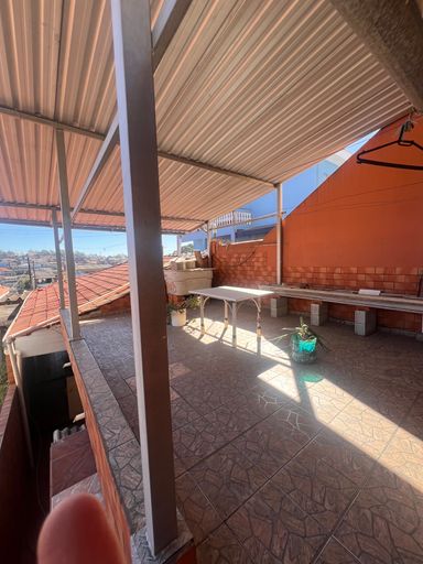 area superior a casa
