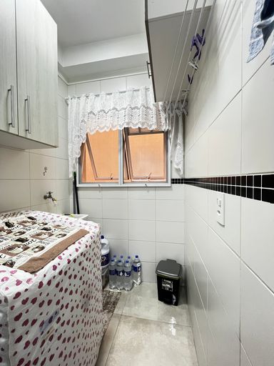 Lavanderia do apartamento do Edifício Moutonnée Residence