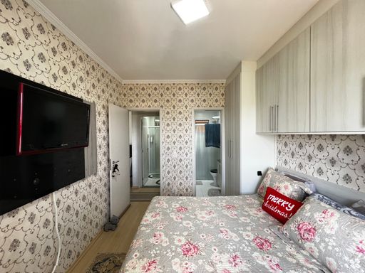 Suíte do apartamento do Edifício Moutonnée Residence