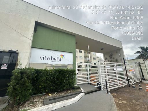 Entrada principal do Condomínio Vita Bella em Porto Velho RO, com portaria, controle de acesso e fachada moderna.