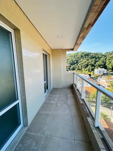 varanda gourmet com vista privilegiada ao Morro do Xixová e acesso a sala 2 ambientes e a área de serviço