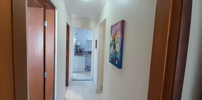 corredor de acesso aos dormitórios e a cozinha