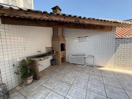 espaço gourmet com churrasqueira a carvão