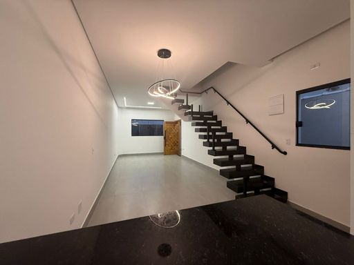 sala ampla 2 ambientes com teto rebaixado e sistema de iluminação embutida em total requinte