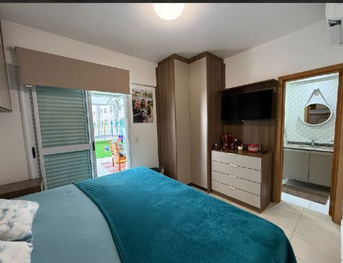 suíte com móveis planejados e acesso a varanda garden