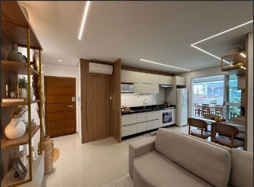 sala ampla 2 ambientes semi integrada a cozinha gourmet, com acesso a varanda garden