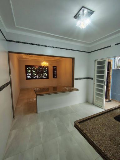 cozinha semi integrada a sala , com acesso a área externa