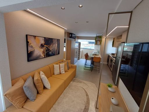 foto do decorado da sala ampla 2 ambientes com acesso a área de serviço