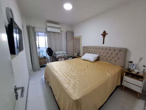suíte 1 com acesso a varanda gourmet com ar condicionado