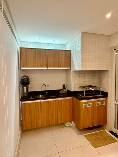 varanda gourmet envidraçada com churrasqueira e cortina blackout