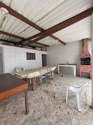 Área gourmet com churrasqueira a carvão