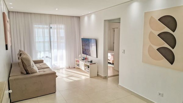 ampla sala 2 ambientes com acesso a varanda gourmet e aos dormitórios