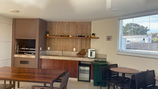 área gourmet envidraçada com churrasqueira