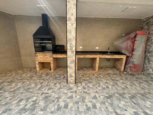 espaço gourmet com churrasqueira a carvão