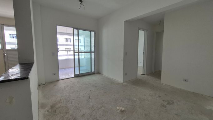 Sala de 2 ambientes com acesso a sacada gourmet.