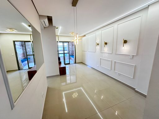 Sala de 2 ambientes com ar-condicionado.