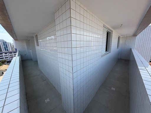 Sacada gourmet em L, com vista para o mar.