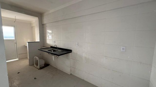 Cozinha com uma pia.