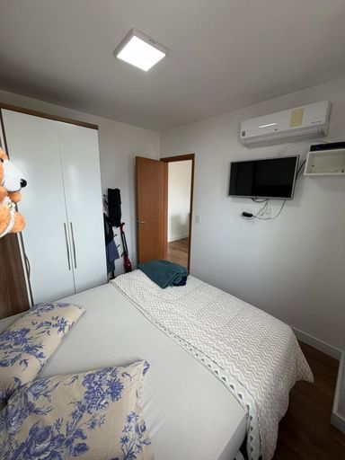 Dormitório planejado com ar-condicionado.